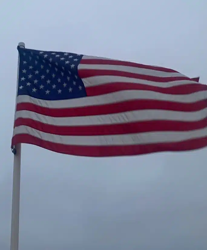 American flag flying against the sky on Independence Day