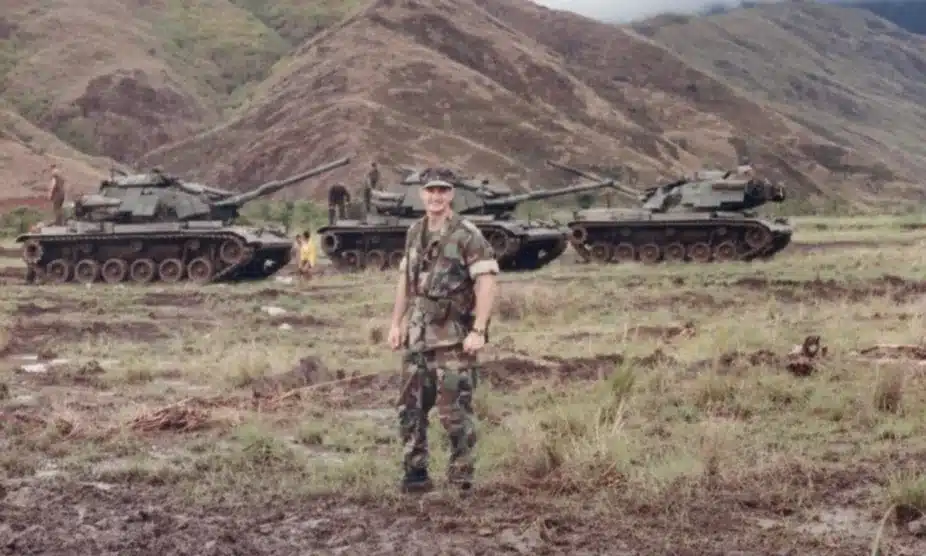 Dr. Lt. Robert Troell in front of a tank platoon during jungle training in the Philippines
