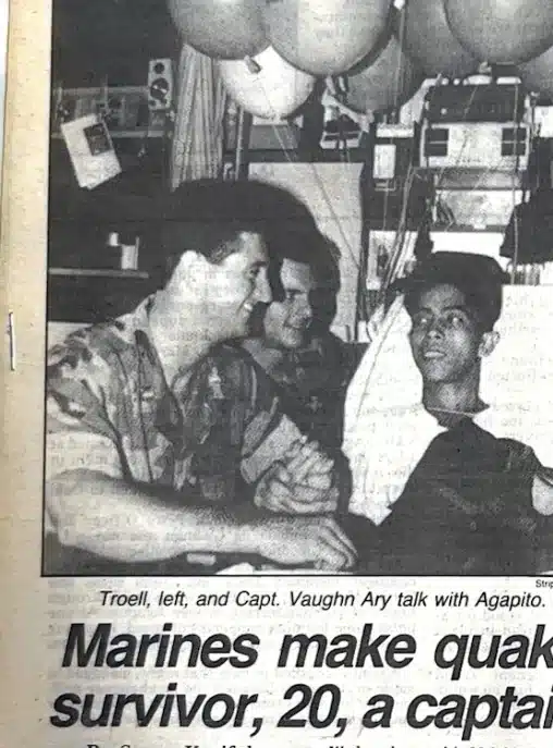 Newspaper coverage of rescue efforts following the 1990 Luzon earthquake, with Dr. Troell and Capt. Vaughn Ary